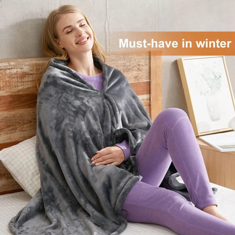 Woman relaxing in the Grey HeatLoop heated fleece wrap